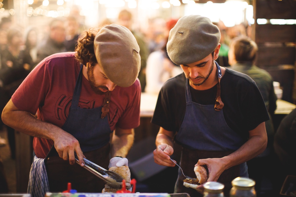 Two chefs prepare hot sandwiches at Feast Marlborough event