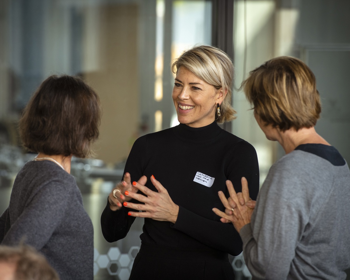 Businesspeople standing up having a discussion