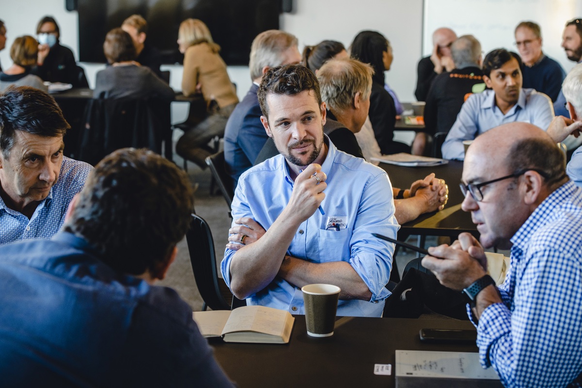 Businesspeople sitting at a table having a discussion